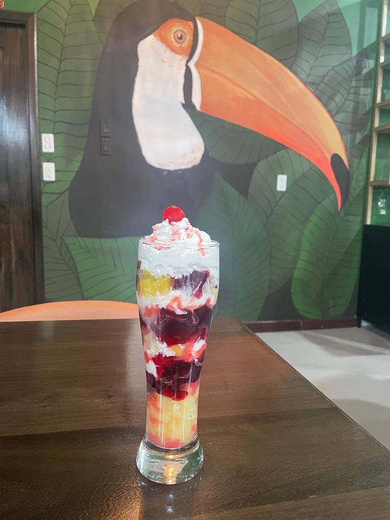 Knickerbocker Glory sundae in front of the toucan mural